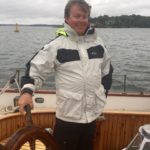 captain ian at helm | sail portland maine